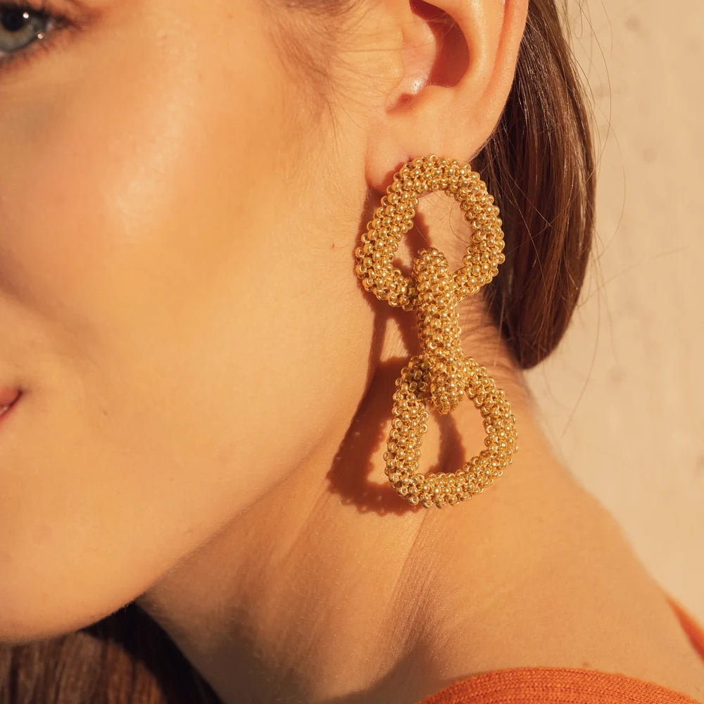 Aretes de corazón entrelazadas Doradas triples